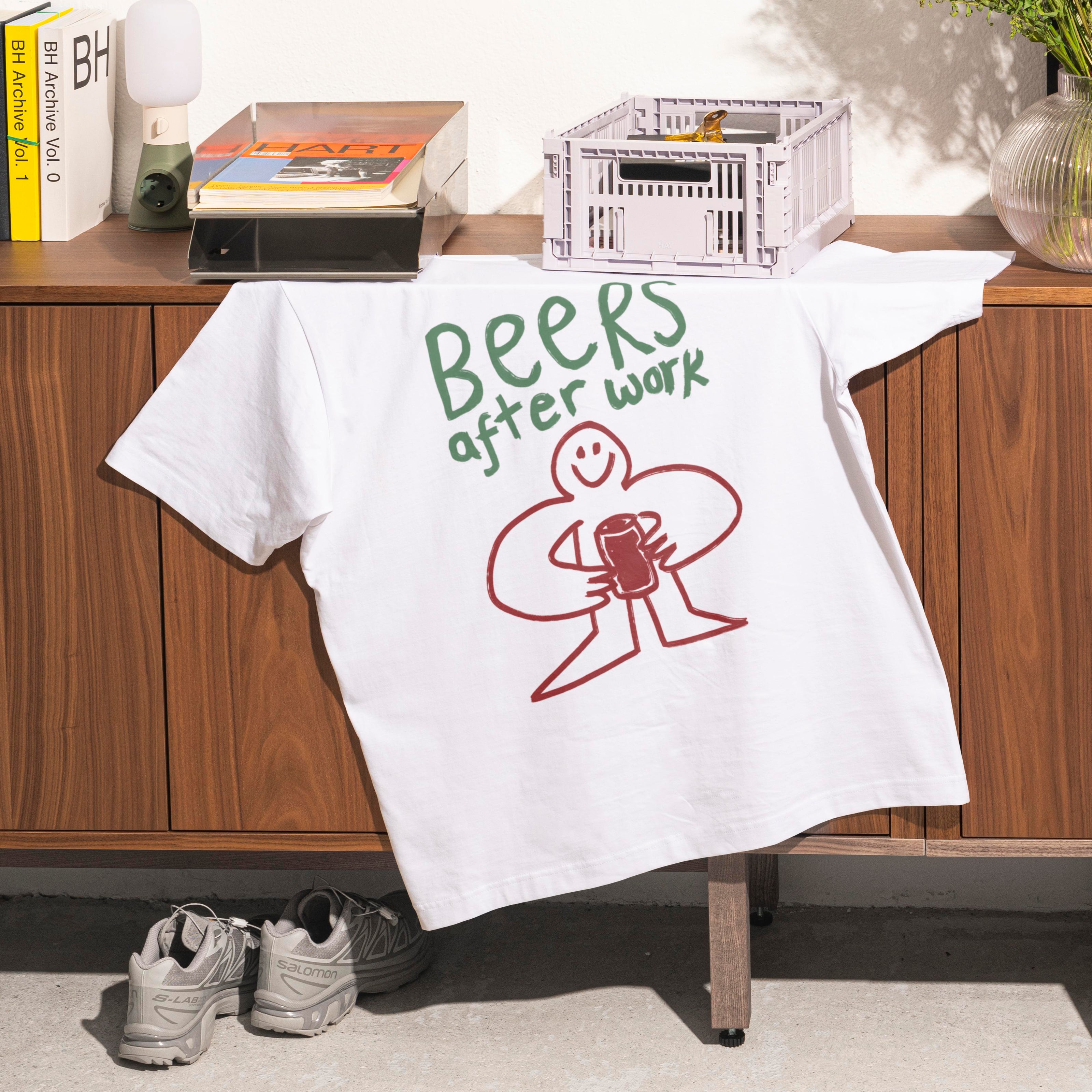 a white t-shirt on a sideboard with a 'beers after work' doodle graphic on it